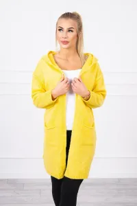 Ordinary sweater with a hood and pockets of mustard